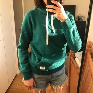 TNA teal colored hoodie